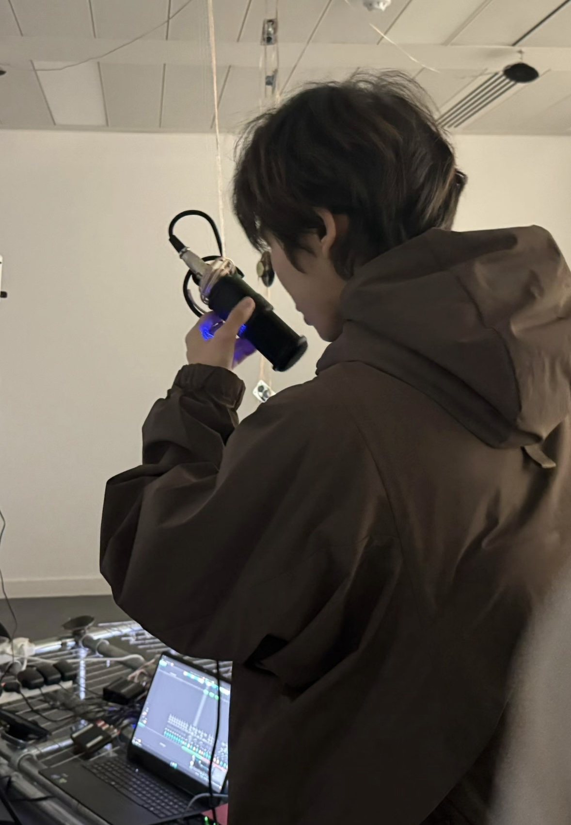 Zhijia Zhang working with an interactive installation